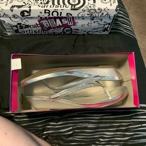 Silver raised flip flops
